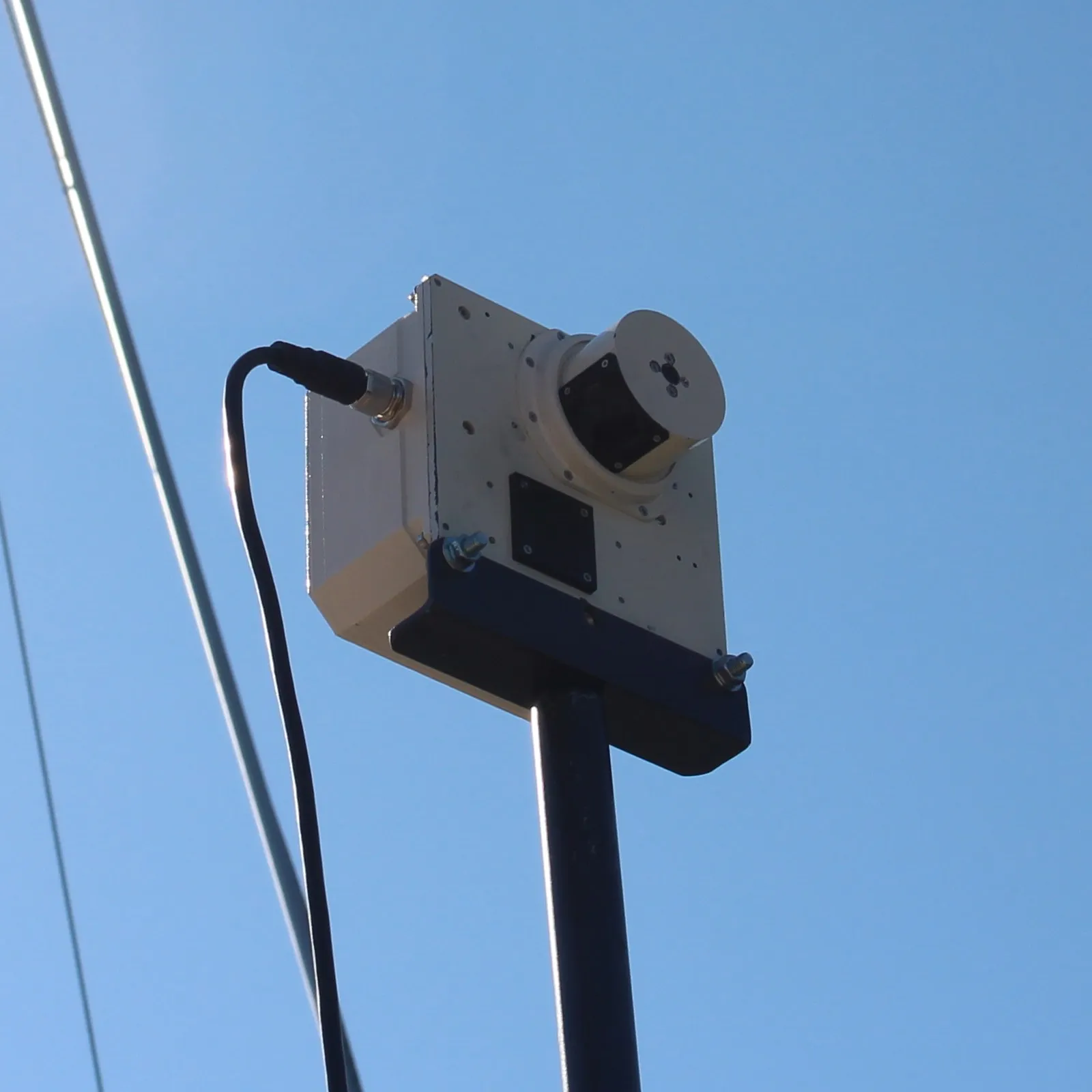 mHR-2 radiometer pole-mounted against clear sky during a vessel deployment